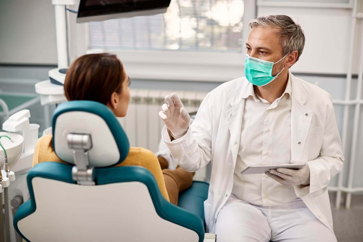 Dentist explaining on treating halitosis