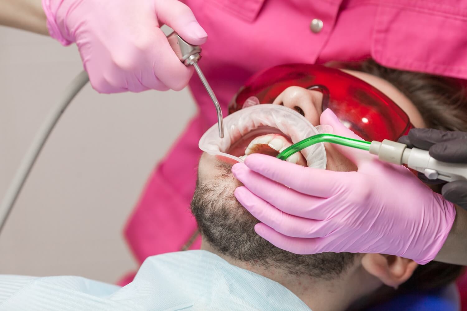 a man having a teeth cleaning in a dental clinic