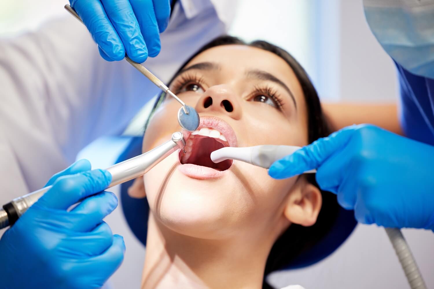a woman patient having dental checkup and clean