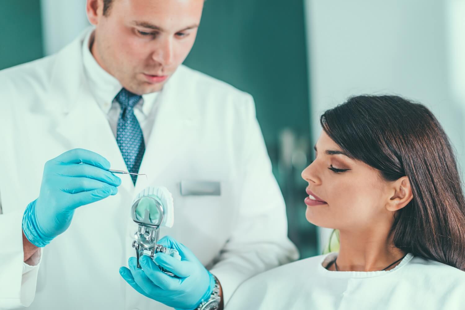 Dentist explaining the dental implant procedure